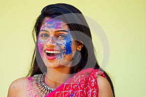 Holi Festival Of Colours. Portrait of happy indian girl in traditional hindu sari on holi color . india woman silver