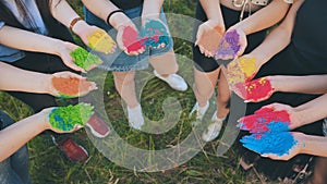 Holi paints in the hands of girls.