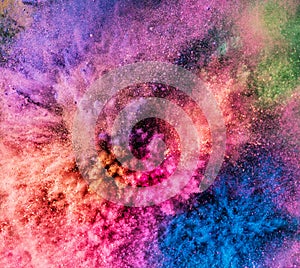 Holi powder bursting up, creating exploding texture.