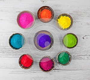 Holi powder in cups arranged in circle