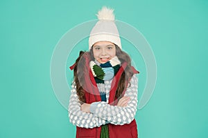 Holiday atmosphere. no hypothermia. cheerful girl wearing layers of clothing. warm cloth at wintertime season. cold