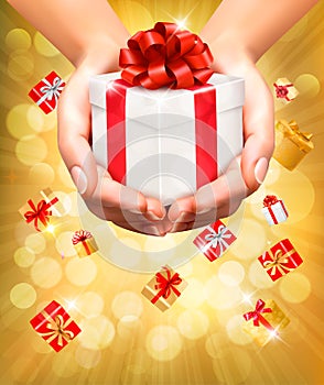 Holiday background with hands holding gift boxes.