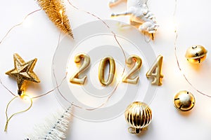 Holiday background Happy New Year 2024. Figures 2024 on a white background with Christmas decorations, balls and a
