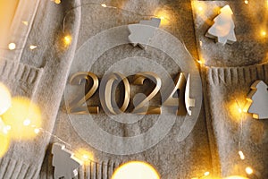 Holiday background Happy New Year 2024. Numbers of year 2024 with sweater