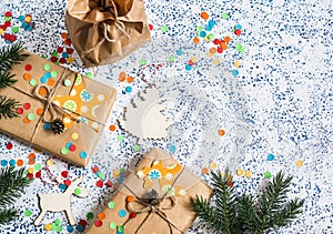 Holiday background. Homemade christmas gifts and decorations on light background. Top view,
