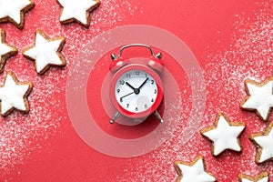 Holiday background made of star shape cookies and analog retro clock