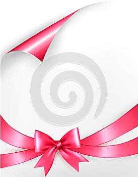 Holiday background with pink gift bow and ribbons.