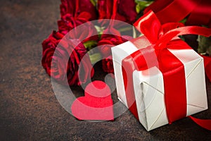 Holiday background with Valentine, present and flower.