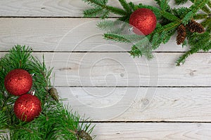 Holiday border of greenery in the upper right and lower left cor