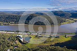 Holiday cabins along the banks of the Hawkesbury River in regional Australia