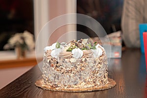 Holiday cake with nuts and frosting topping