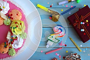 Holiday cake on the table with different little things for the holiday