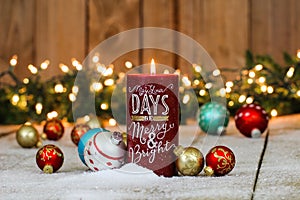 Holiday candle with Christmas decorations