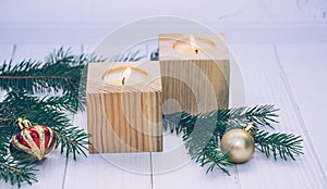 Holiday candles and Christmas toys. New Year`s traditional decor