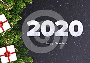 Holiday card. Happy New Year 2020. Snow numbers, fir tree branches, gift box and candy canes on dark background. Celebration decor