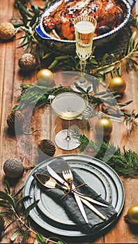 Holiday celebration table setting over rustic wooden background, selective focus