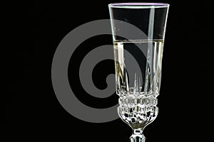 On a holiday, champagne is poured into a crystal glass