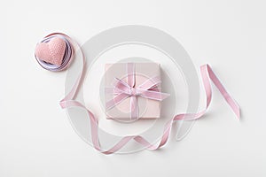 Holiday concept greeting card for Birthday, Woman or Mothers Day. Pink heart, ribbon and gift box top view