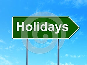 Holiday concept: Holidays on road sign background