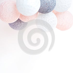 Holiday concept. Illumination from balls with threads. Jewelry and accessories. Birthday. Pastel shades