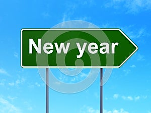 Holiday concept: New Year on road sign background