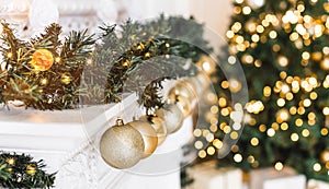 Holiday decorated room with Christmas tree and decoration, background with blurred, sparking, glowing light.