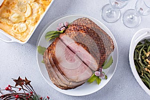 Holiday dinner with honey glazed spiral cut ham and all the sides