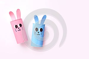 Holiday easy DIY craft idea for kids. Toilet paper roll tube toy's cute rabbit's on minimal background banner