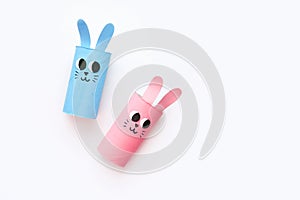 Holiday easy DIY craft idea for kids. Toilet paper roll tube toy's cute rabbit's on minimal background banner