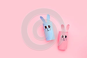 Holiday easy DIY craft idea for kids. Toilet paper roll tube toy's cute rabbit's on minimal background banner