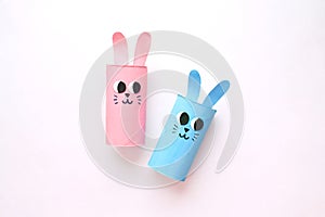 Holiday easy DIY craft idea for kids. Toilet paper roll tube toy's cute rabbit's on minimal background banner