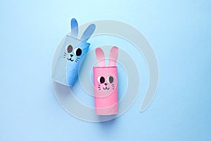 Holiday easy DIY craft idea for kids. Toilet paper roll tube toy's cute rabbit's on minimal background banner