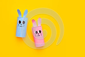 Holiday easy DIY craft idea for kids. Toilet paper roll tube toy's cute rabbit's on minimal background banner