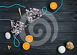 Holiday elements: swimsuit, stones, seashells, fruits. Travel photo, flat lay, top view