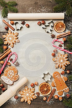 Holiday food background for baking gingerbread cookies. Vintage paper sheet for christmas recipe. Text space, top view.