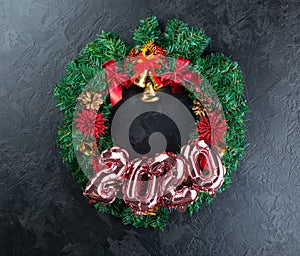 Holiday frame of Christmas decorations on dark stucco concrete background