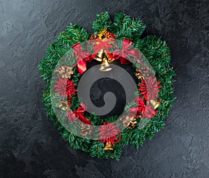 Holiday frame of Christmas decorations on dark stucco concrete background