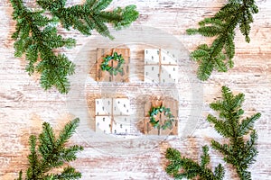 Holiday gift boxes with pine branches