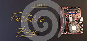 Holiday greeting card for Father`s Day on a black background - machines, computer boards, with the text - Happy Father`s Day photo