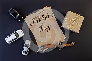 Holiday greeting card for father`s day with text on a black background, brutal