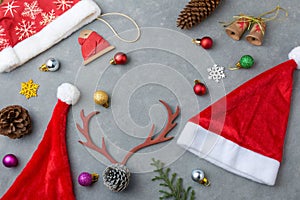 Holiday hats and decor on grey background photo