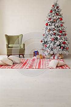 Holiday Interior White Christmas tree with gifts and decorations garlands of lights new year