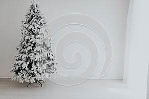 Holiday Interior White Christmas tree with gifts and decorations garlands of lights new year