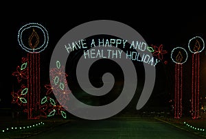 holiday lights at night spelling out have a happy and healthy holiday photo