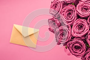 Holiday love letter and flowers delivery, luxury bouquet of roses and card on blush pink background for romantic holiday design