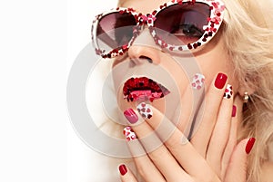 Holiday makeup and manicure with red hearts