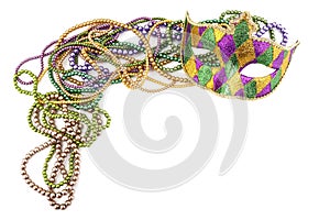 Holiday or mardi gras beads and mask making frame isolated on white background