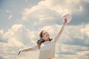 Holiday objects. Happy child with colorful air balloons over blue sky background. express positive emotions. just have
