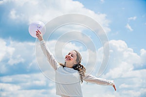 Holiday objects. Happy child with colorful air balloons over blue sky background. express positive emotions. just have