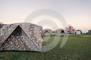 holiday outdoor camping : tourist tent camping in mountains, family vacation picnic on holiday relax, overview of camping of